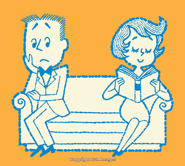 Couple Sitting on Sofa, Woman Reading Book, Man Looking Concerned