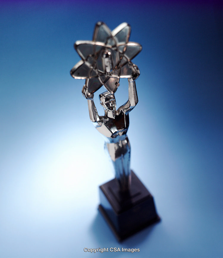 Silver Trophy Depicting a Figurine with an Atomic Symbol Overhead