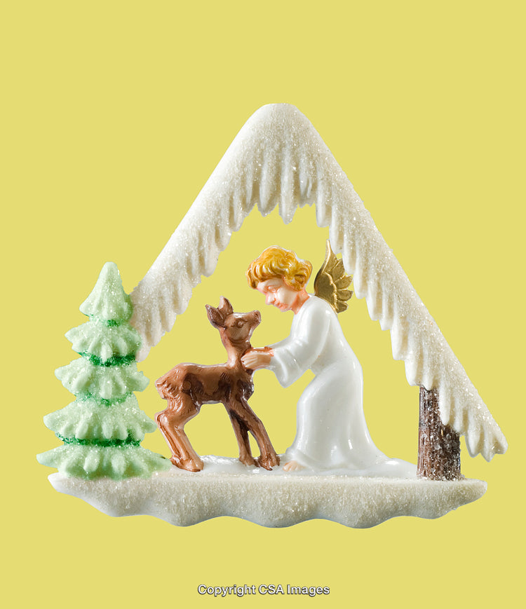Angel Figurine with Fawn Under Snowy Arch and Christmas Tree Decor