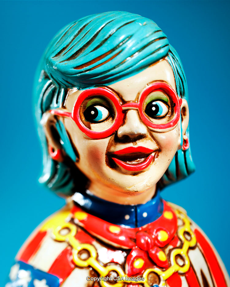Colorful Figurine with Vibrant Expression and Retro Charm on Blue Background