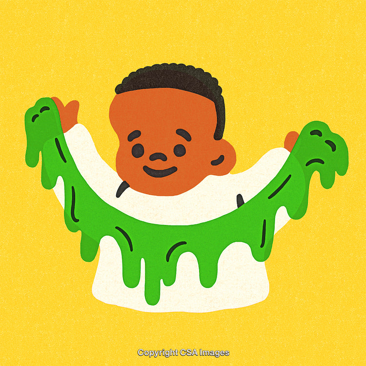 Young Boy Playing with Green Slime on a Bright Yellow Background