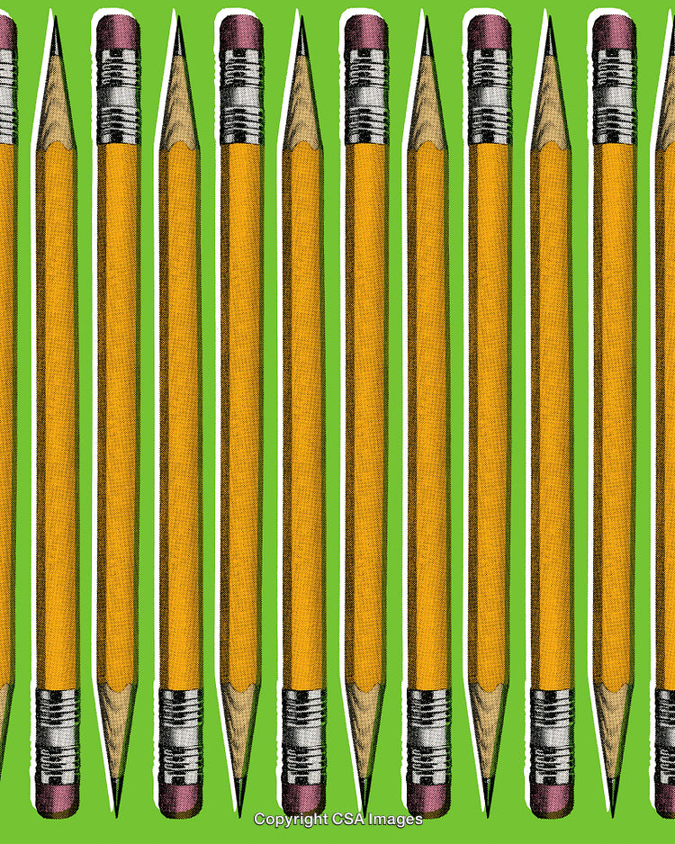 Colorful Arrangement of Pencils Displayed on a Bright Green Background
