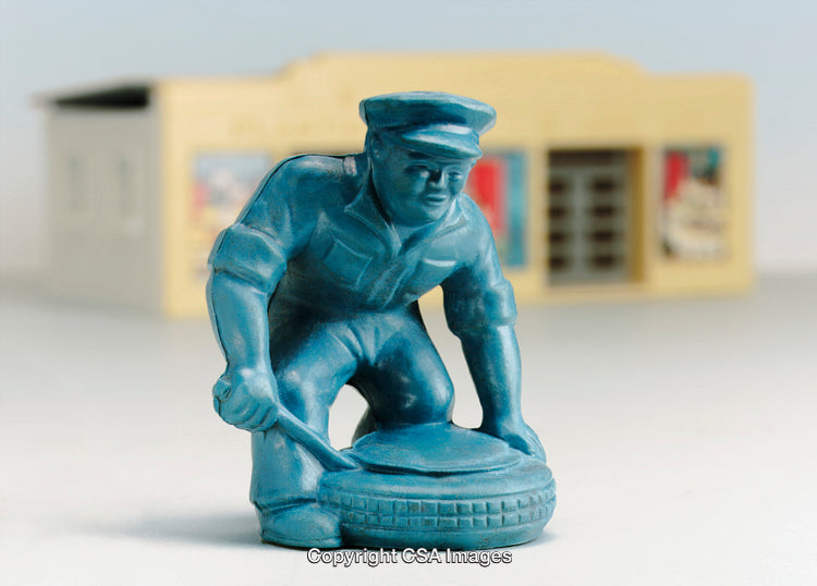 Vintage Style Plastic Toy Mechanic Figurine with Tire