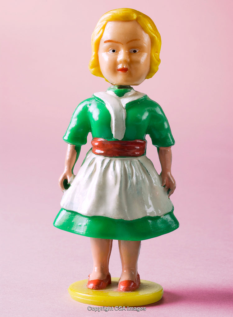 Vintage Female Figurine in Green Dress with Pink Background