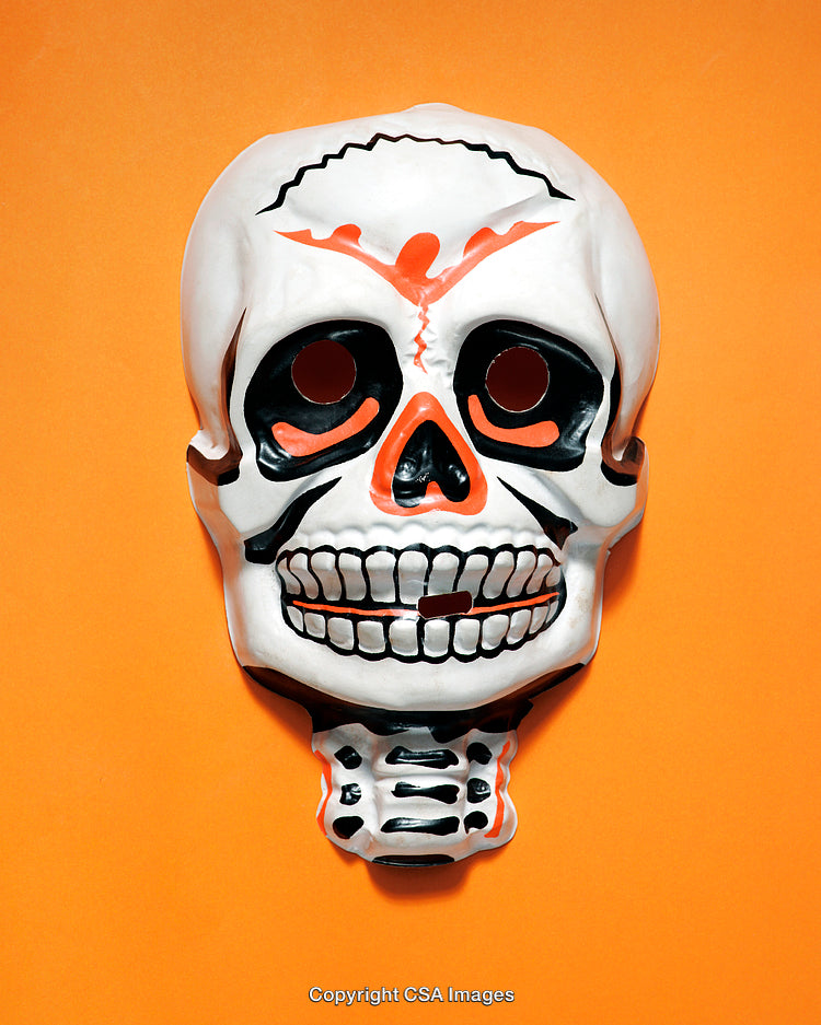 Plastic Halloween Skull Mask on a Vibrant Orange Background with Artistic Details