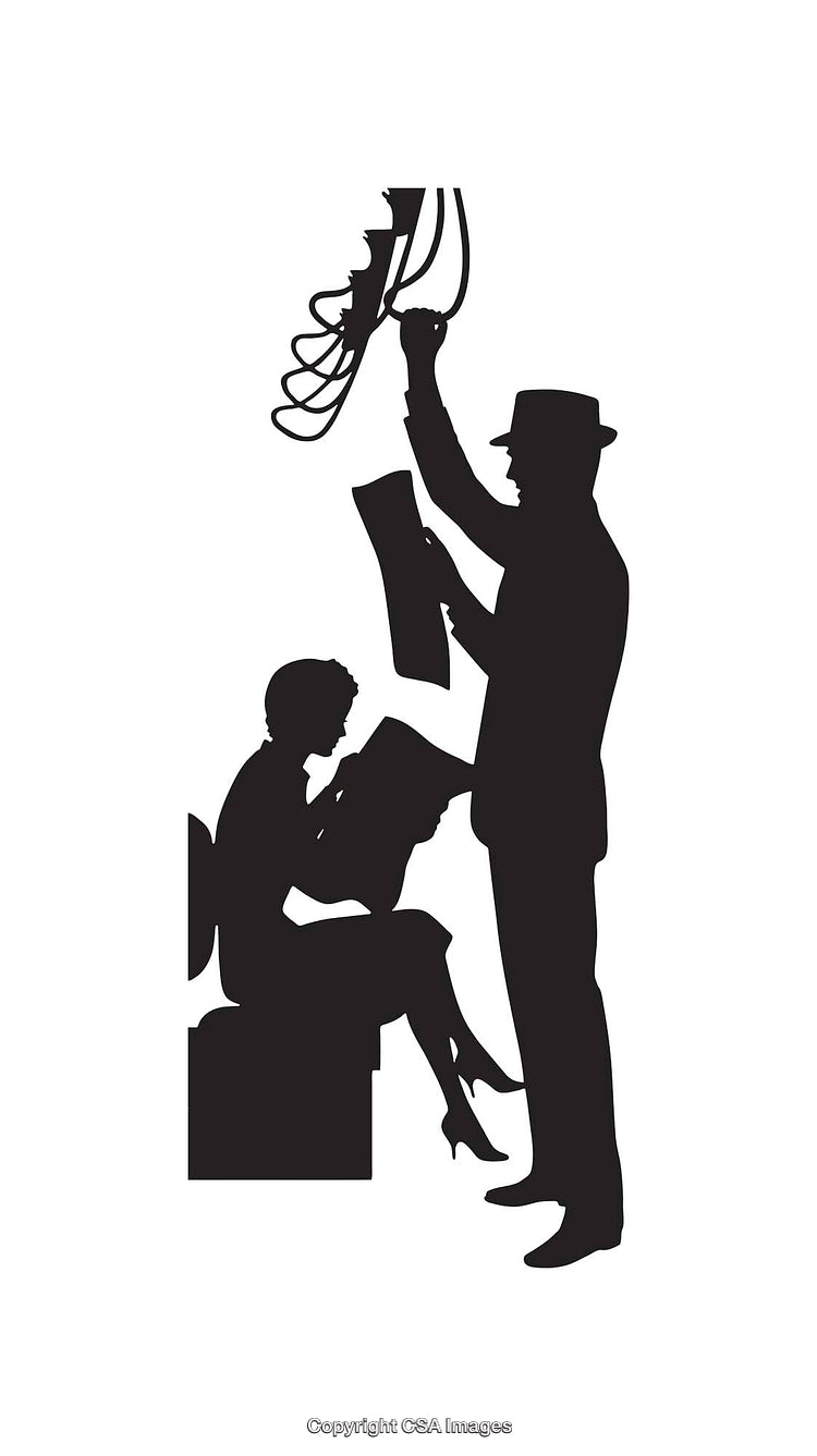 Silhouette of Two Individuals Engaged in Creative Activity