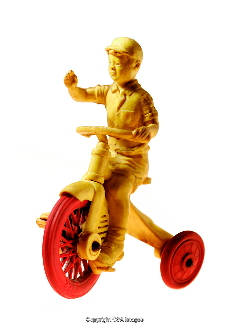 Vintage Yellow Plastic Figure Riding Red-Wheeled Tricycle with Hand Raised