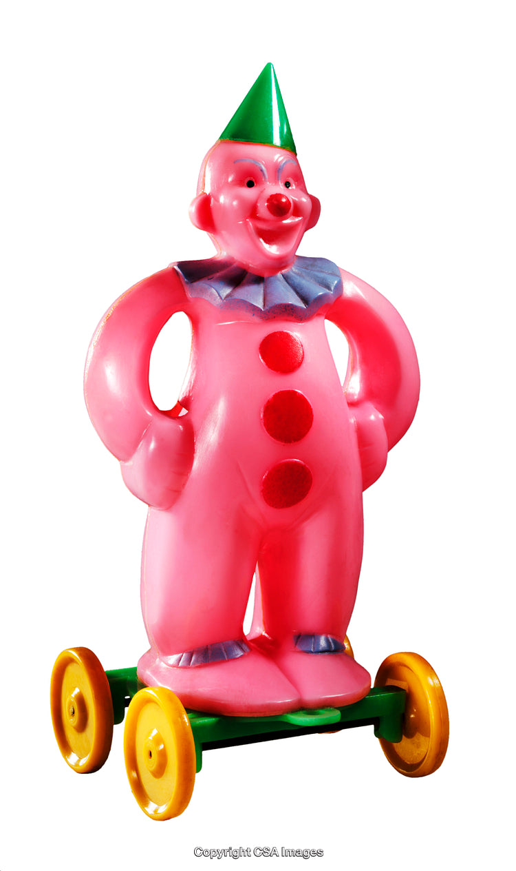 Colorful Plastic Clown Toy Figure on Rolling Wheels Isolated on White