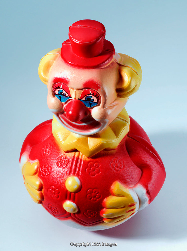 Vintage Plastic Clown Toy with Bright Colors and Cheerful Design