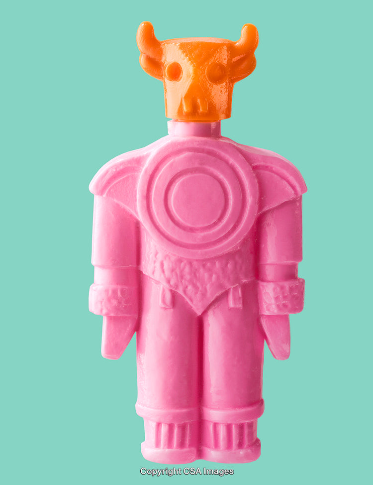 Colorful Plastic Figurine with Unique Design on a Turquoise Background