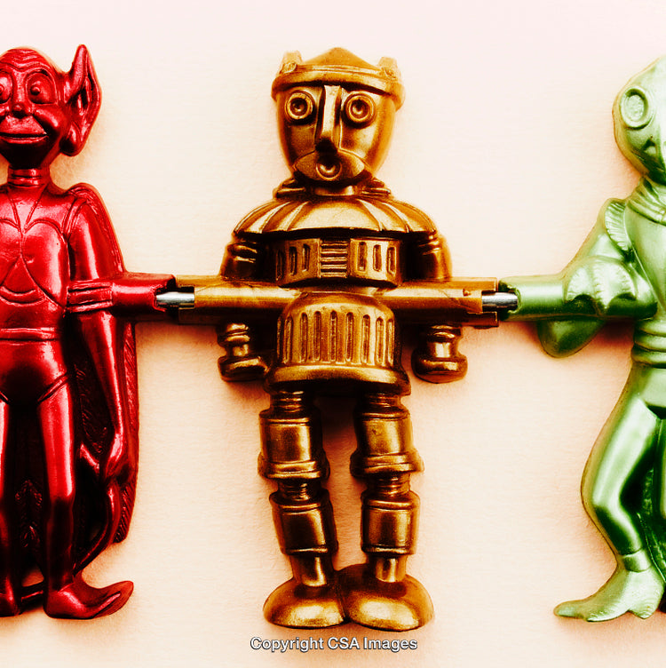 Colorful Plastic Robot and Alien Figures Holding Hands Displayed Together