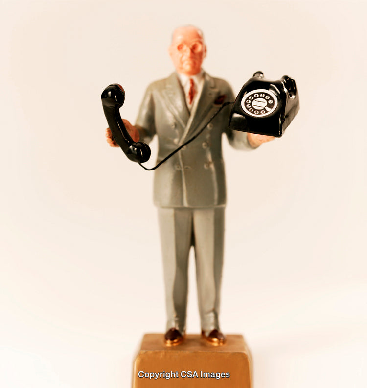 Retro Toy Figure Holding Rotary Telephone in Classic Suit Style