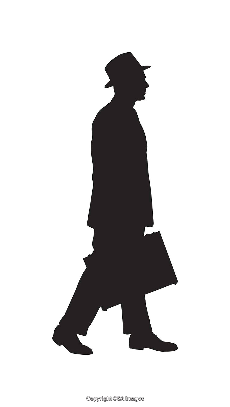 Silhouette of a Businessman Walking With a Briefcase in Profile View