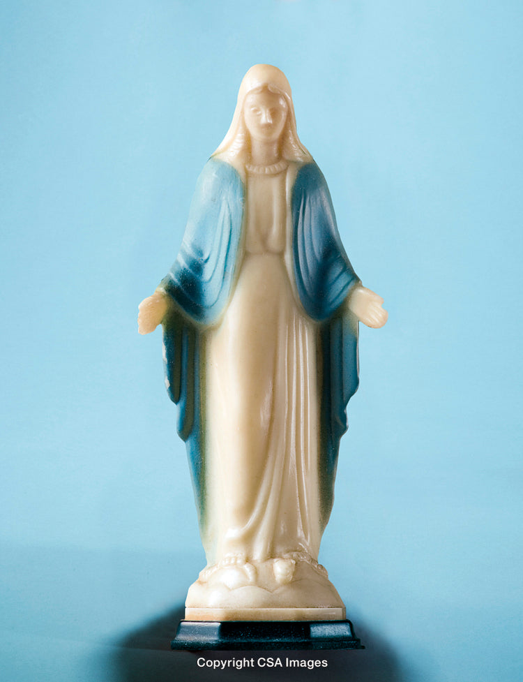 Plastic Figurine of a Religious Figure on a Light Blue Background