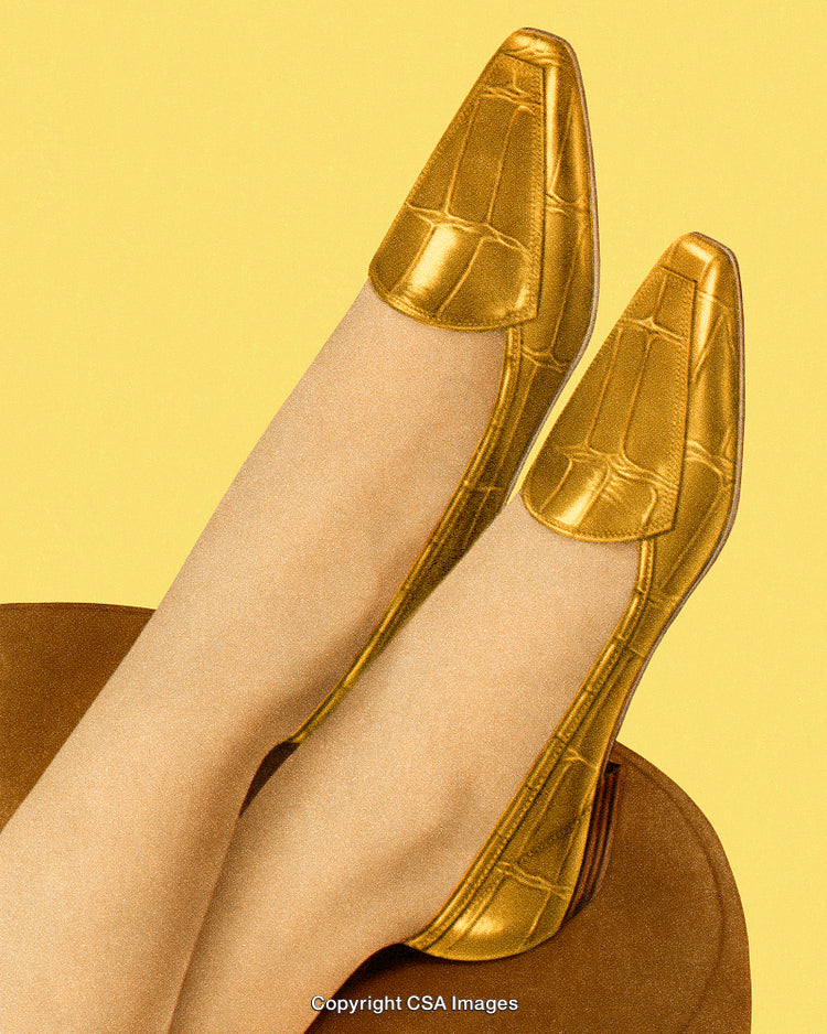 Stylized Image of Golden Shoes Against a Vibrant Yellow Background