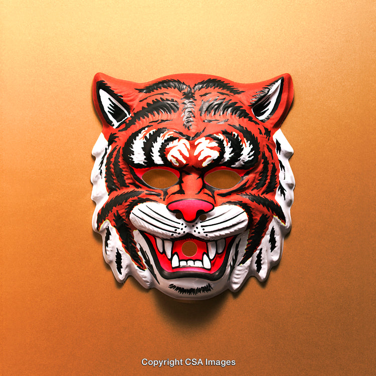 Brightly Colored Tiger Mask Against Vibrant Orange Background