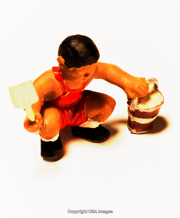 Plastic Toy Figurine of a Child with Tools and Bucket