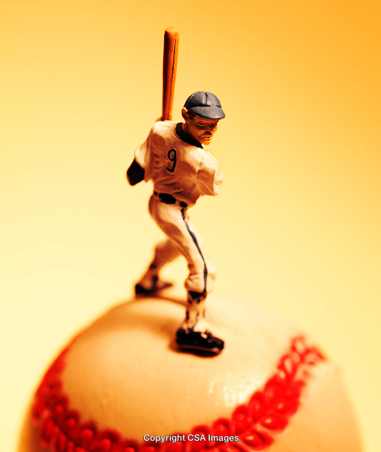 Baseball Player Figurine on a Baseball With Yellow Background