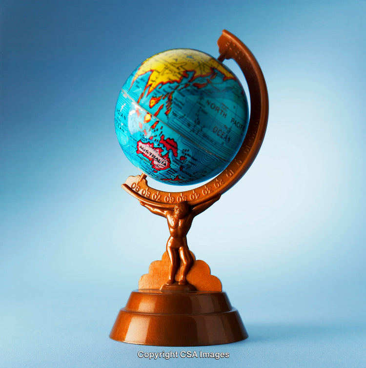 Atlas Statue Holding a Globe with a Sky Blue Background