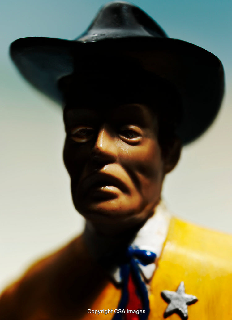 Portrait of a Cowboy Figurine with Detailed Features and Western Attire