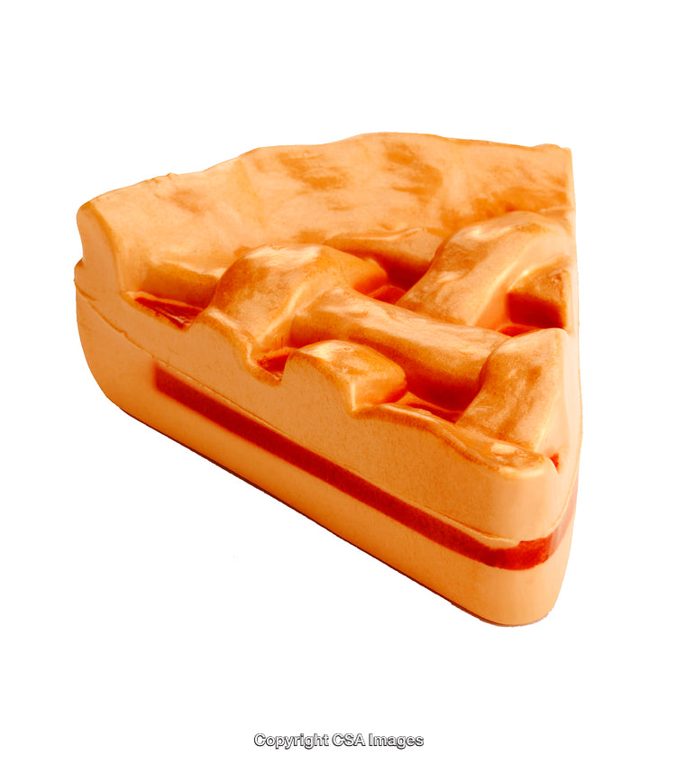 Close-Up of a Foam Waffle Shaped Toy against White Background