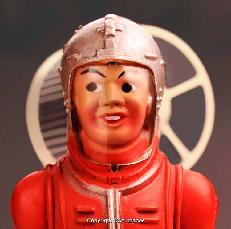 Vintage Space-Themed Toy Figurine With Red Suit and Helmet