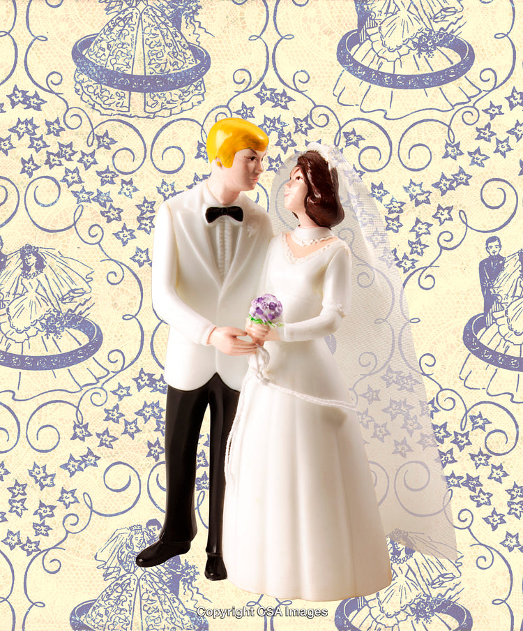 Plastic Wedding Figurines on Decorative Blue and Cream Background