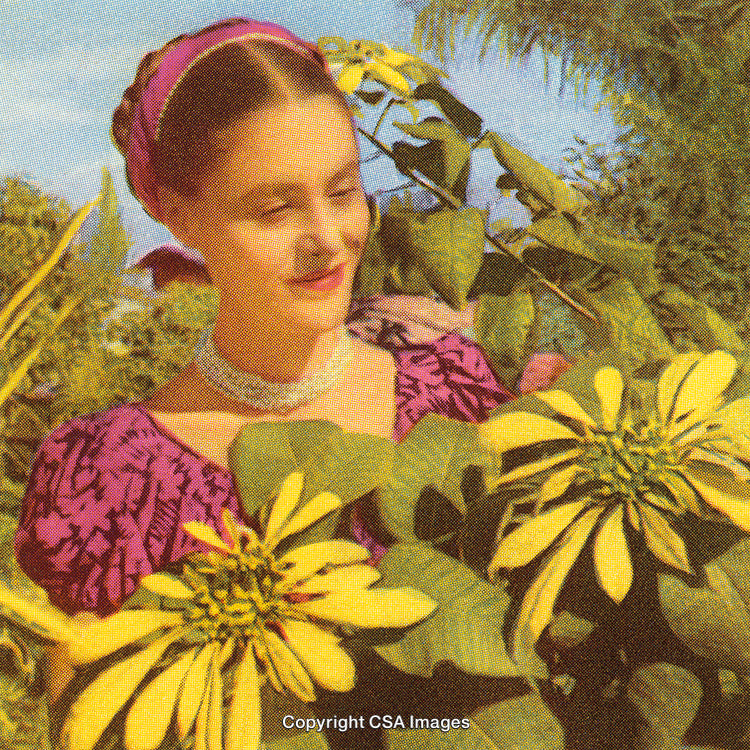 Woman in a Garden Surrounded by Beautiful Yellow and Green Foliage