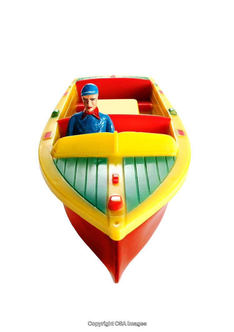 Colorful Vintage Toy Boat with Captain on White Background