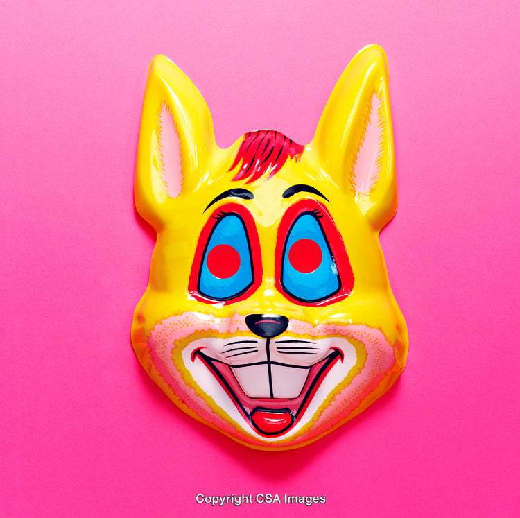 Vibrant Yellow Animal Mask on a Bright Pink Background