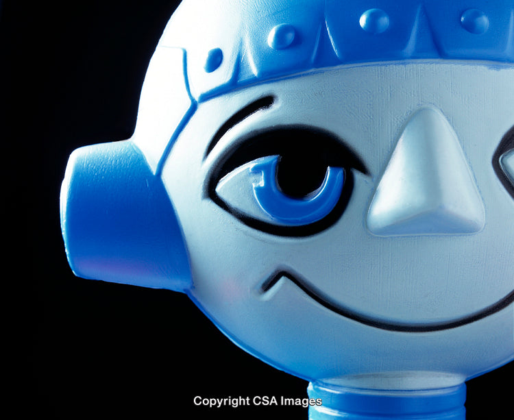 Close-Up of a Blue Plastic Toy Character Face with Artistic Lighting