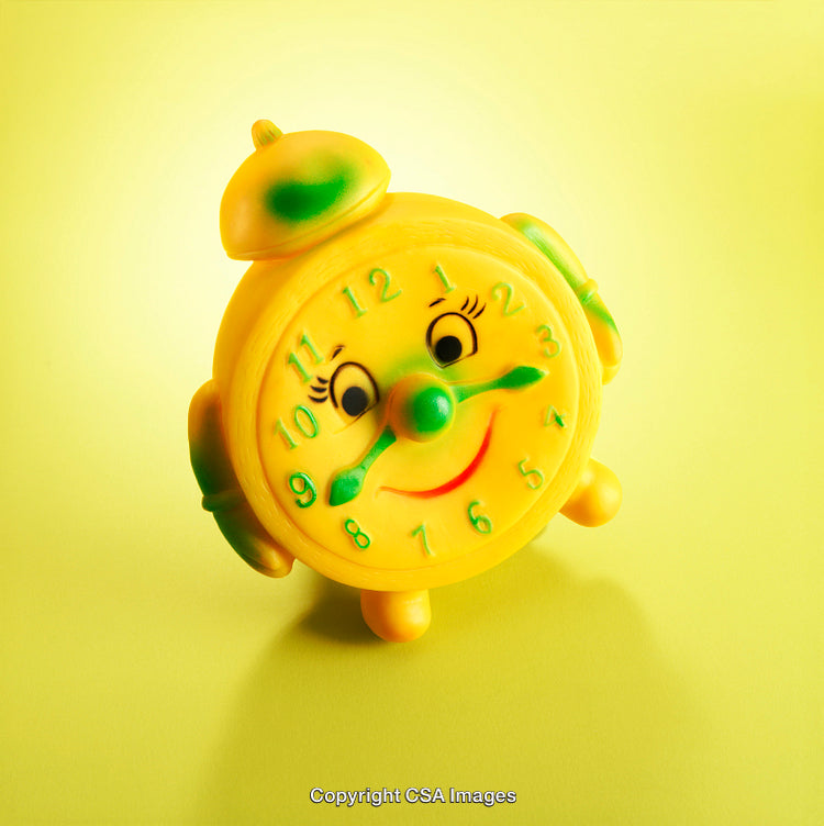 Smiling Yellow Toy Clock on Bright Yellow Background