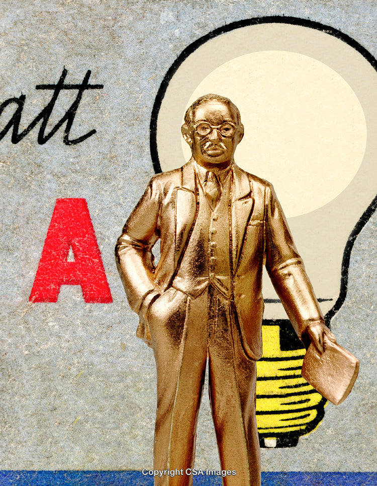 Golden Figurine of a Businessman with Creative Backdrop and Lightbulb Design