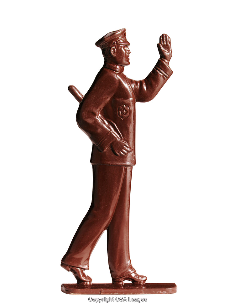 Vintage Plastic Policeman Figurine in Retro Police Uniform on White Background