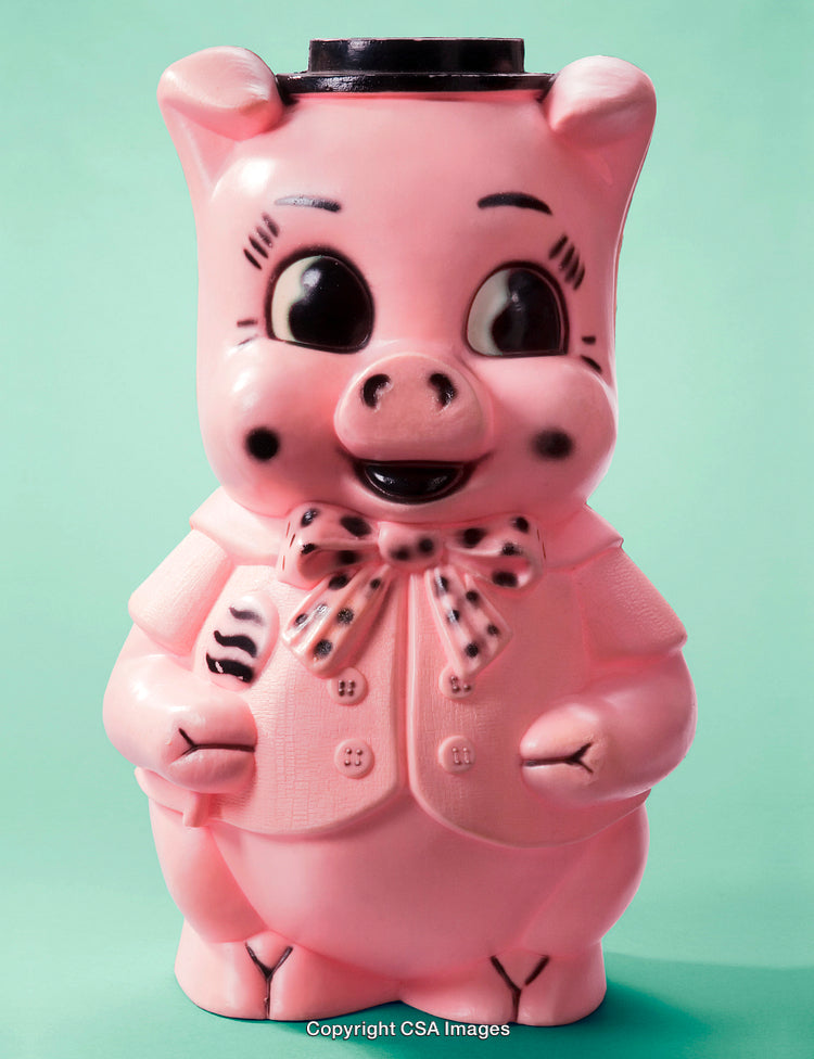 Pink Piggy Figurine with Bow Tie on Colorful Background