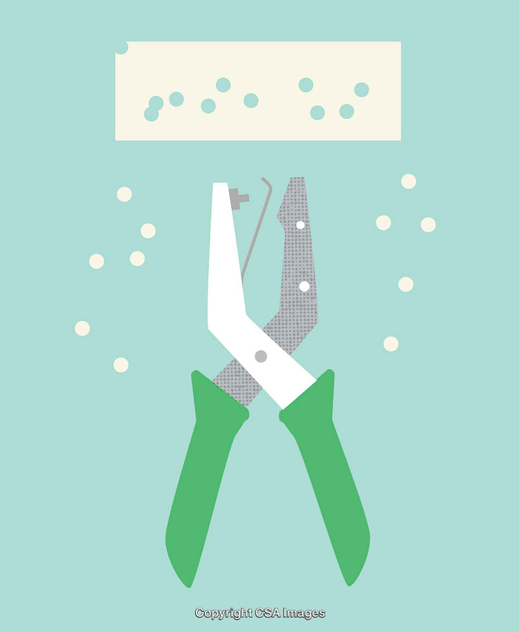 Simple Illustration of a Handheld Hole Punching Tool With Paper