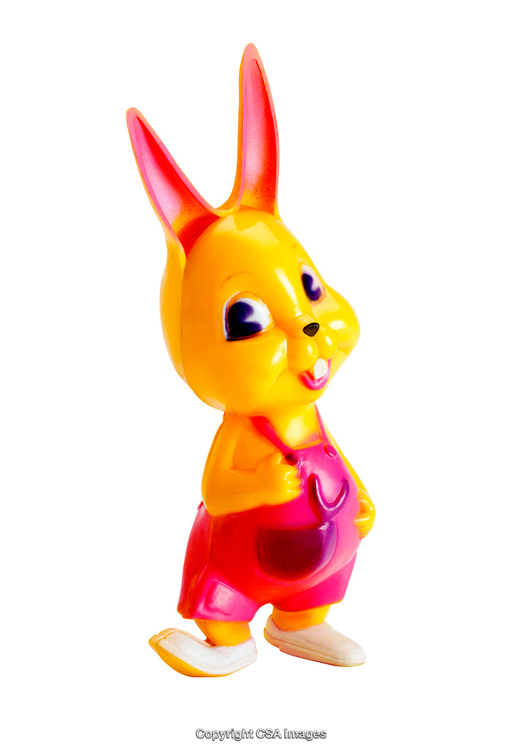 Colorful Plastic Rabbit Toy Dressed in Overalls on White Background