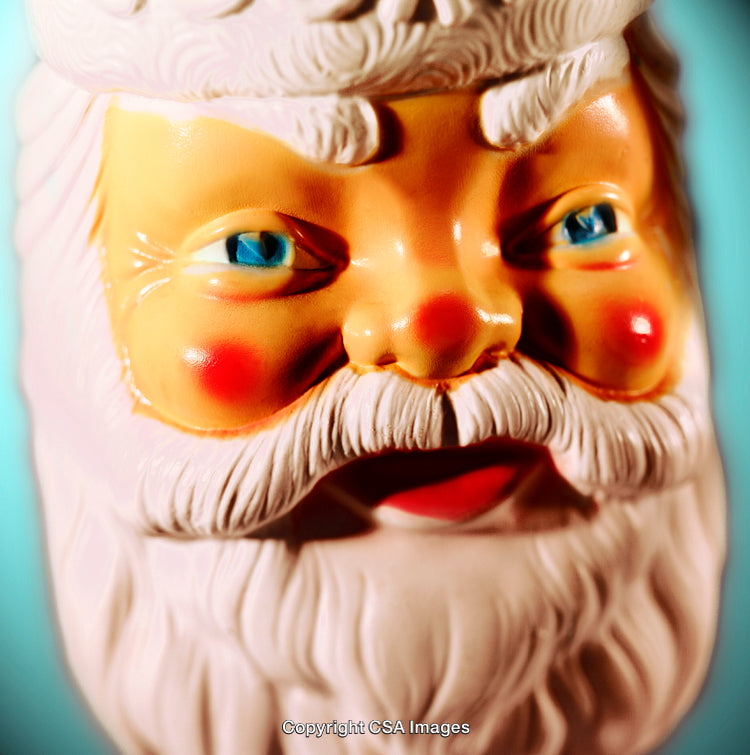 Close-Up of a Santa Claus Figurine with a Festive Backdrop