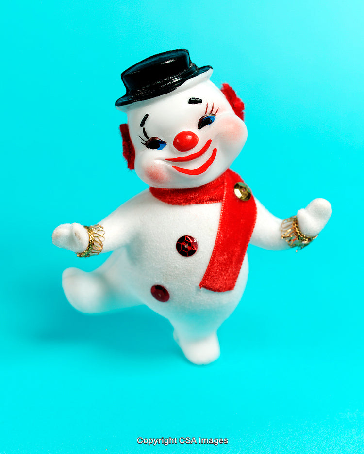 Playful Snowman Toy Figurine on Vibrant Blue Background
