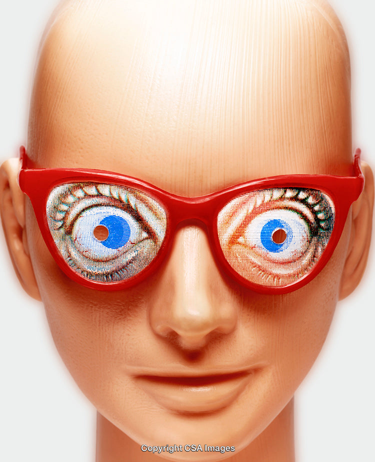 Plastic Mannequin Toy Wearing Red Glasses With Cartoonish Eye Design