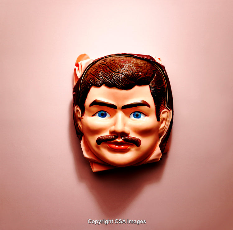 Vintage Plastic Halloween Mask on Pink Background