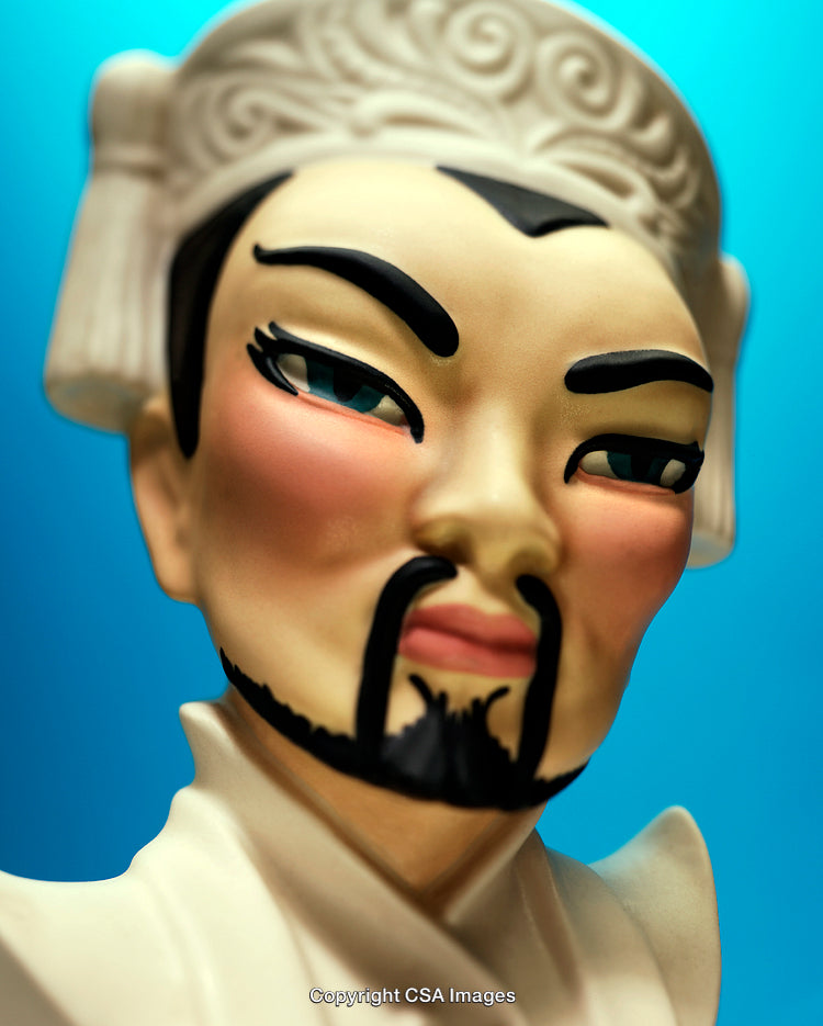 Close-Up of a Detailed Figure with Expressive Craftsmanship on Blue Background