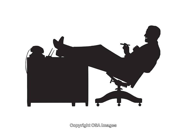 Silhouette of Relaxed Businessperson Leaning Back in Chair at Office Desk