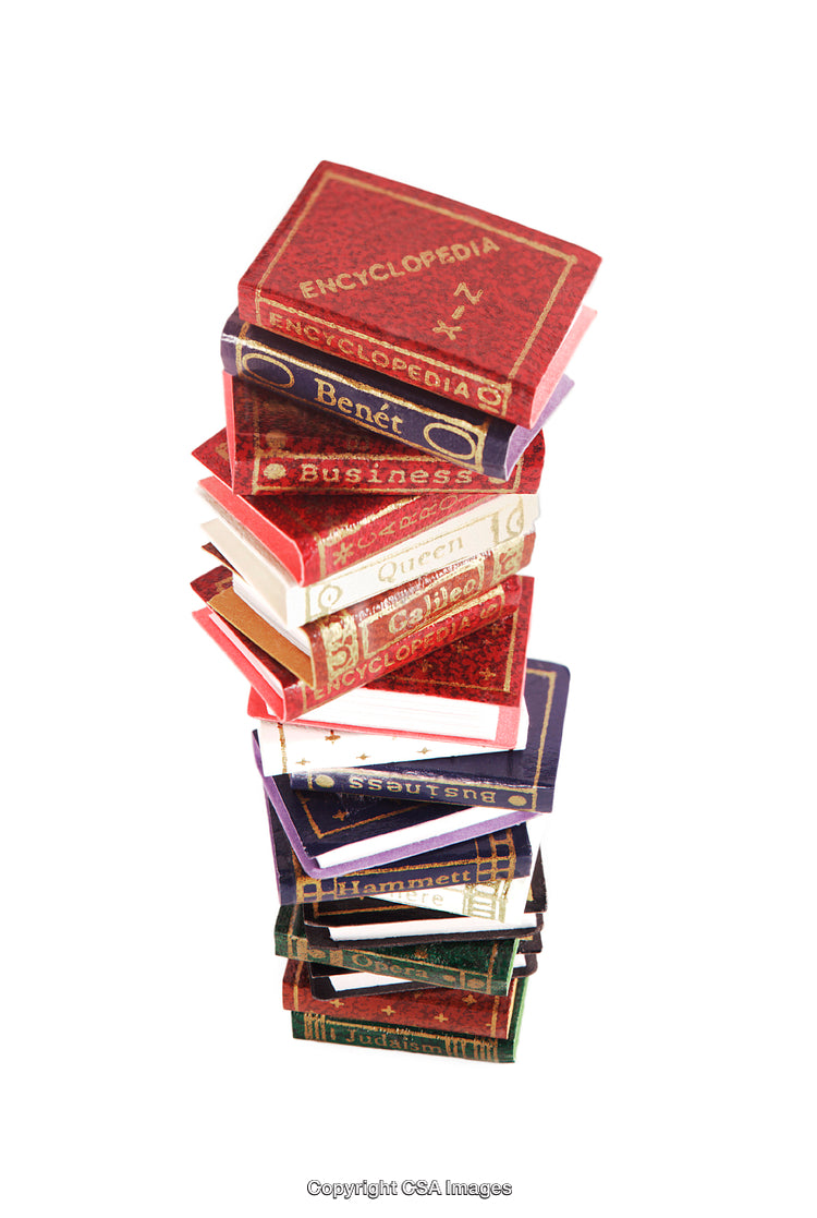 Stack of Miniature Encyclopedia Books in Vibrant Colors Isolated on White