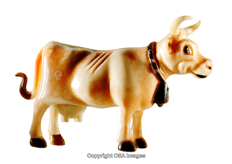 Vintage Plastic Figurine of a Decorated Cow on White Background