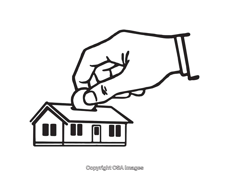 Hand Placing Coin in House Shaped Slot for Savings Concept