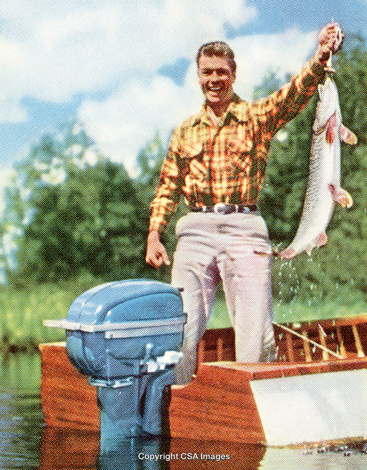 Man Fishing on Lake Holding Fish Near Wooden Boat With Engine