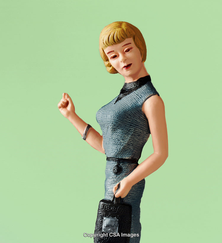 Stylish Retro Figurine with Handbag on a Pastel Green Background