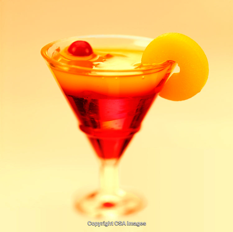 Vibrant Summer Cocktail in Martini Glass with Fruit Garnishes