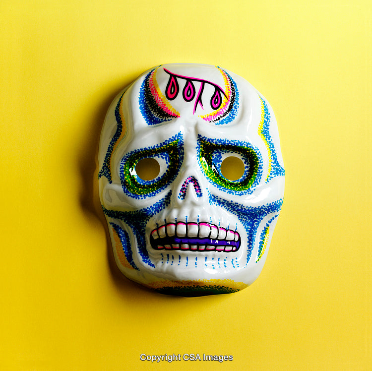 Colorful Artistic Skull Mask on Bright Yellow Background